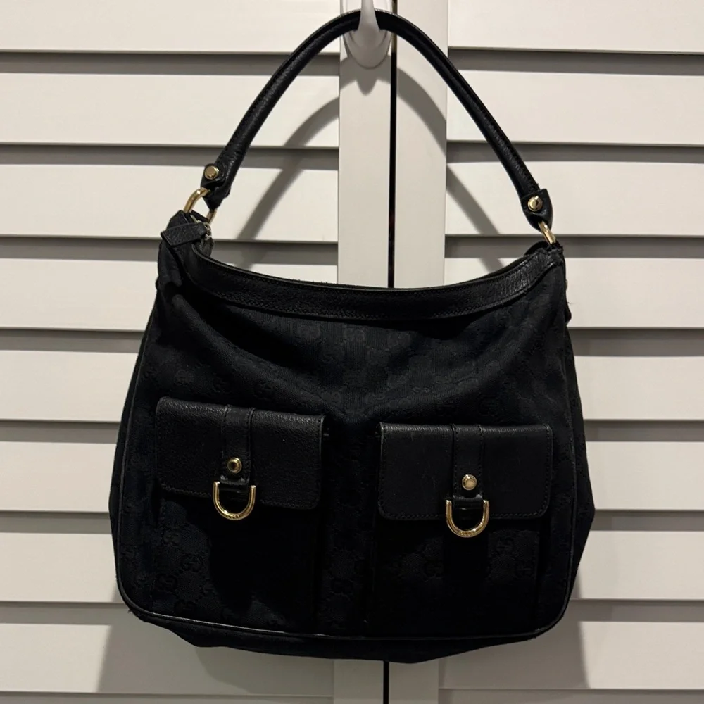 Gucci Black Shoulder Bag with Gold Accents, there is a flaw look at the pictures